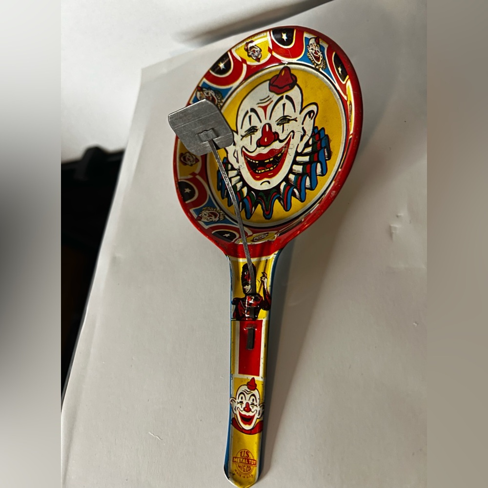 Vintage U.S. Metal Toy Mfg. Co Tin Noise Maker Deep Pan Rattle Clown Blue Back